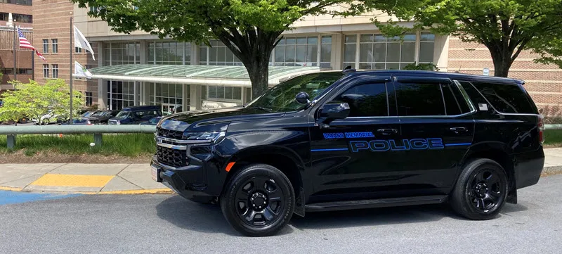 A UMass Memorial Police cruiser on the road.